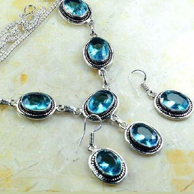 Tpz 767b collier boucles oreilles 34gr 10x15mm topaze bleu suisse argent 925 vente